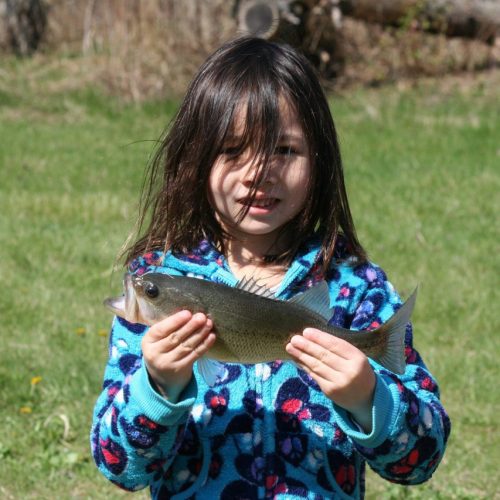 Girl holding a fish